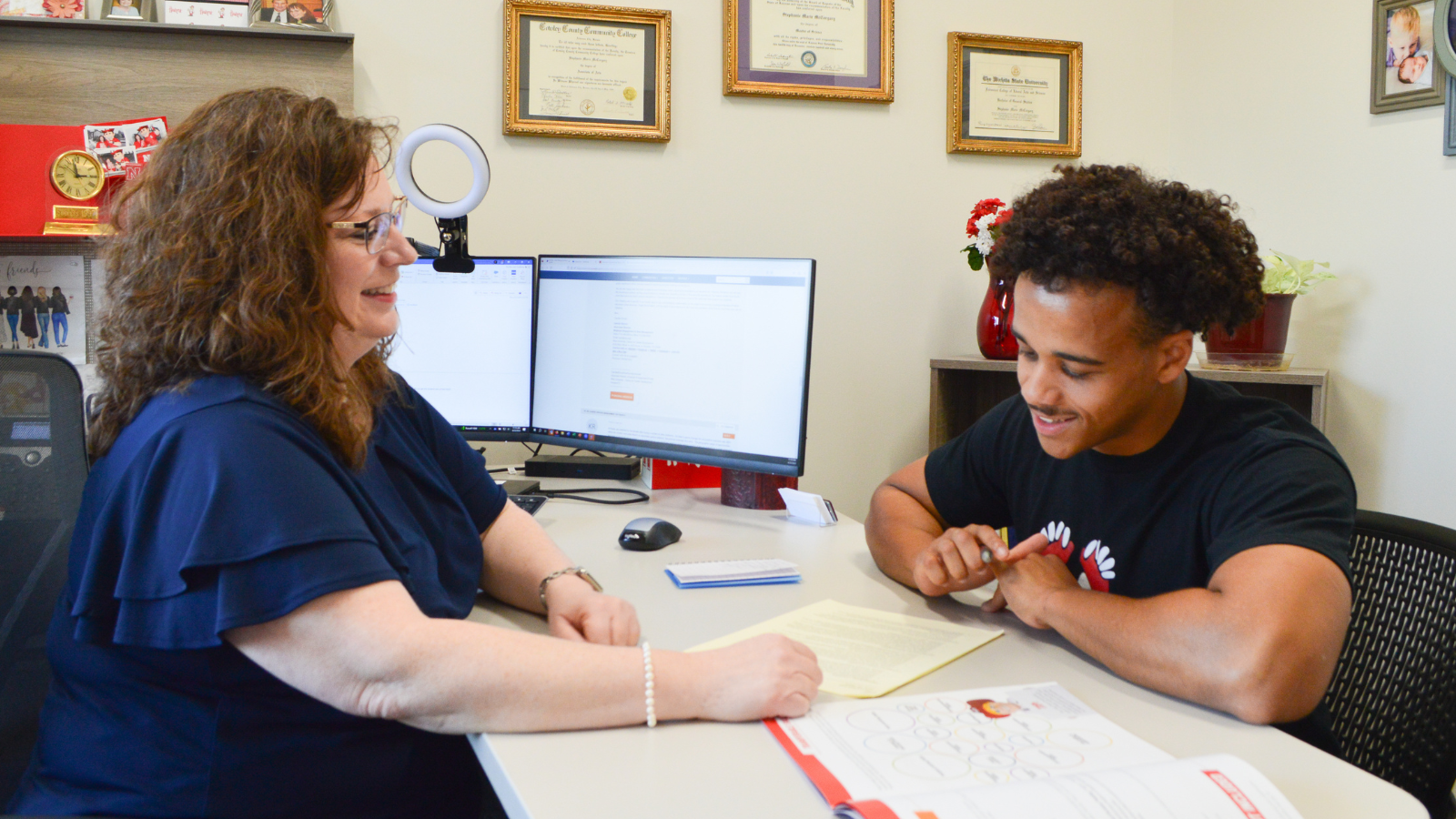 Career Coach, Stephanie Osterthun, meets with student to review their resume