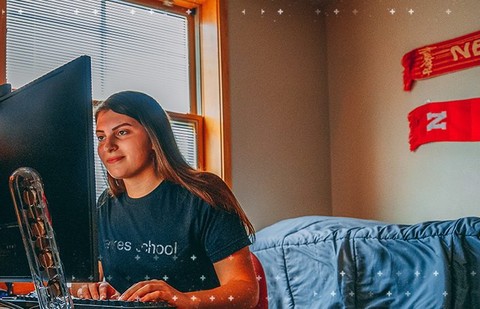 Girl in dorm at computer