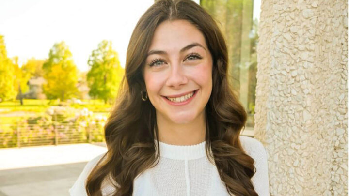 UNL freshman Abbie Fox stands next to wall