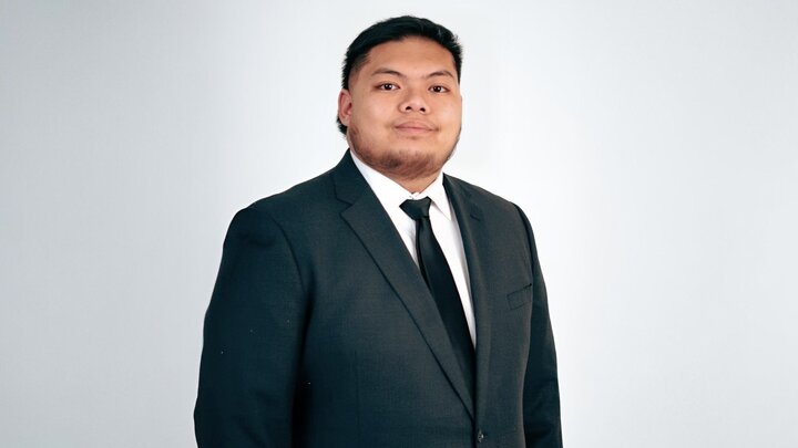 Corey smiling for a professional headshot.