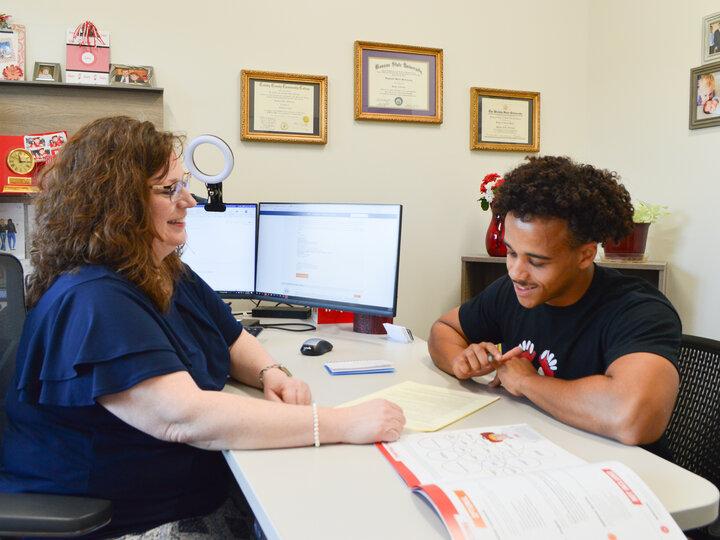 Career Coach Osterthun meeting with a student in her office