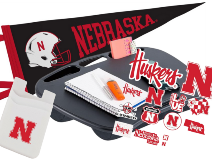 A lap desk, a UNL pennant, phone wallet, and a UNL themed sticker pack!