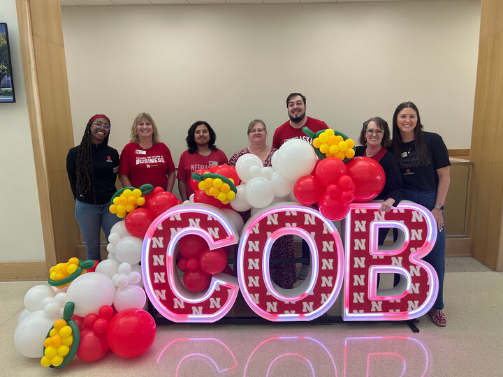 Business career team infront of a COB sign.