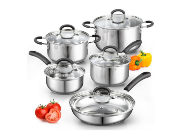 Stainless steel cookware set with cut vegetables beside it